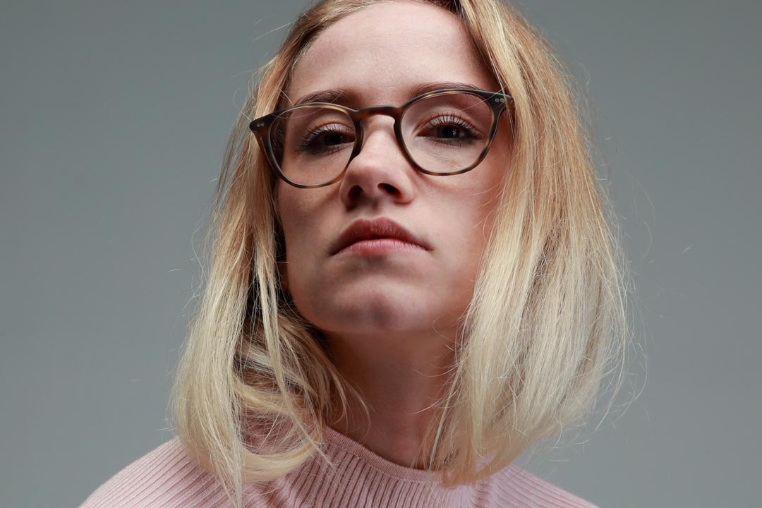 Lady with blonde hair wearing tortoiseshell cateye spectacles frame